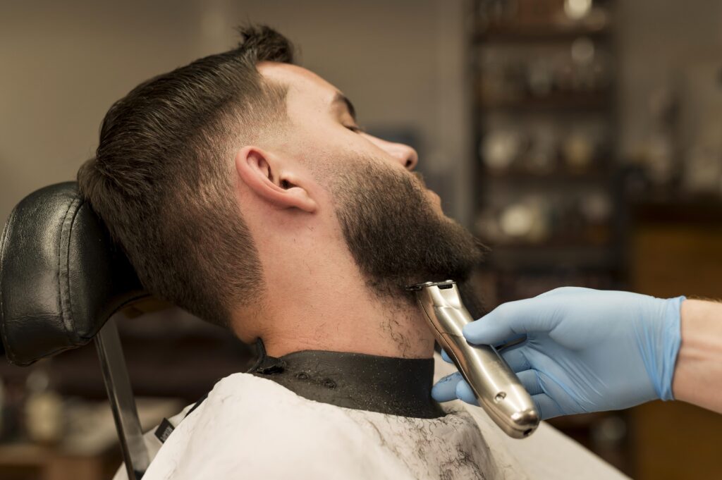 Chubby man getting hair cut in Oakville salon
