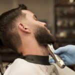 Chubby man getting hair cut in Oakville salon